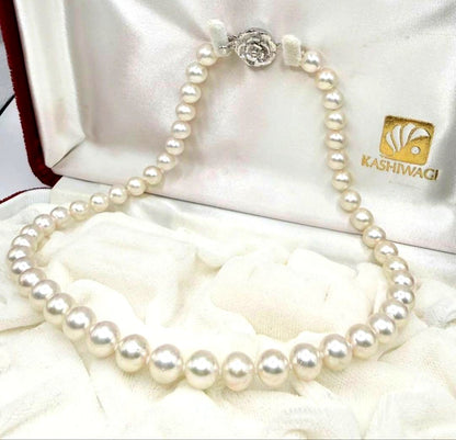 Yamato Akoya Pearl Necklace with 8mm white pearls, 39cm length, displayed on a black jewelry stand