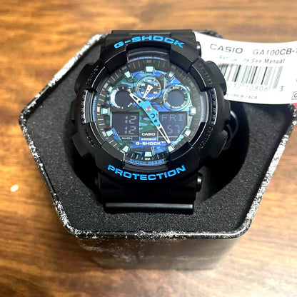 Casio G-Shock GA100CB-1A black blue watch with digital and analog display, battery included, Japan import