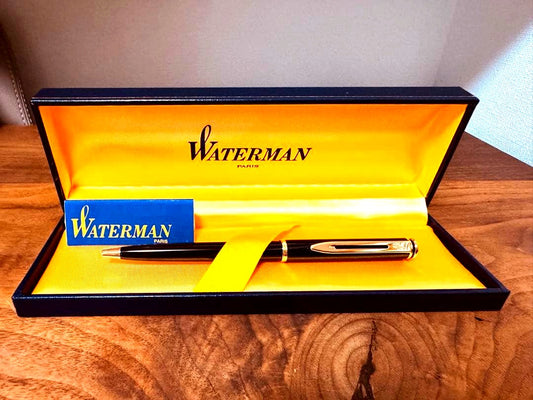 Waterman black ballpoint pen main body with tip extended against white background