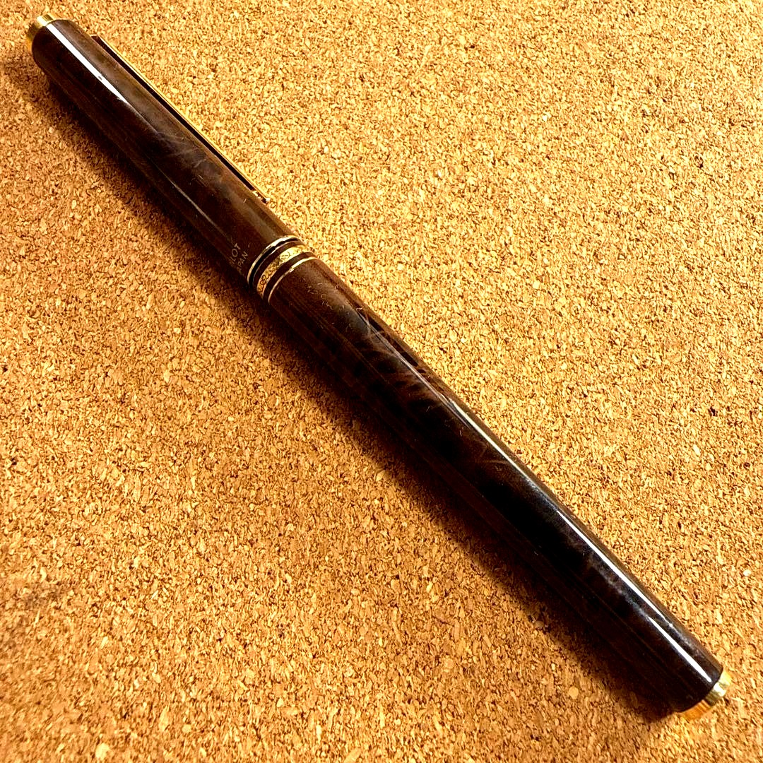 Vintage Pilot fountain pen with marble barrel and fine nib shown uncapped