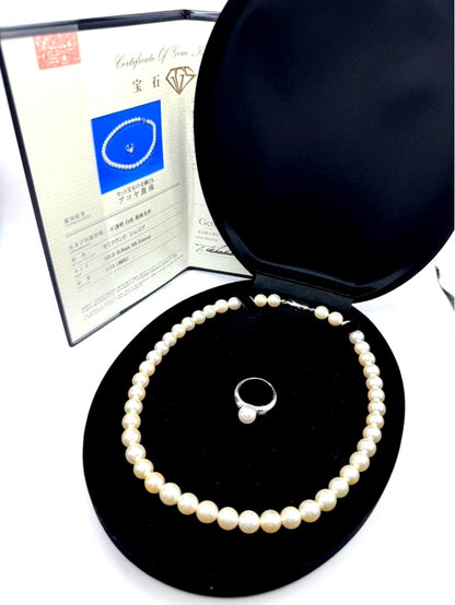 Akoya pearl silver necklace and diamond ring set with pearls sized 8.5 to 9.0 mm displayed on white background
