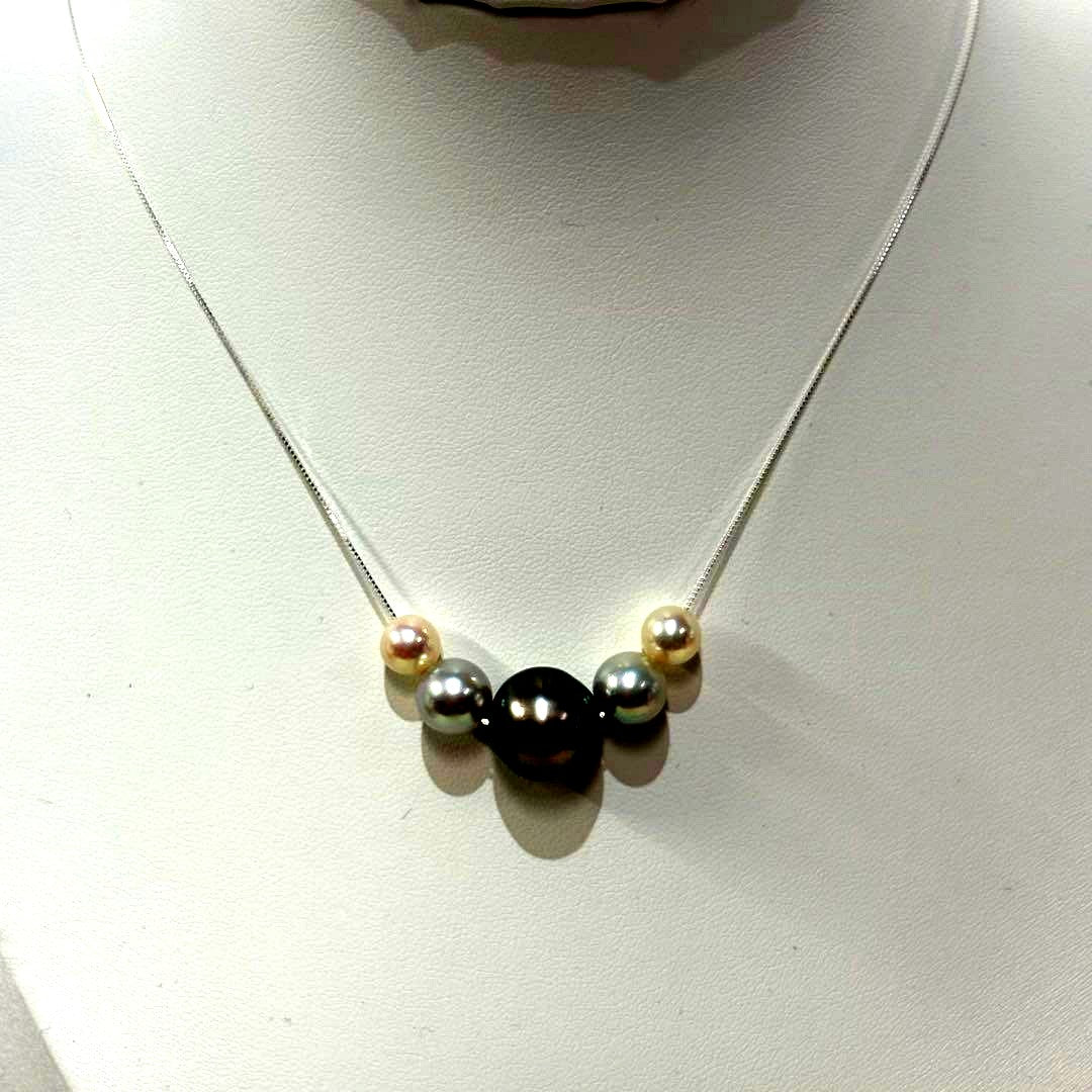 Akoya pearl necklace with black peacock pearl pendant and varying pearl sizes on a 42cm strand