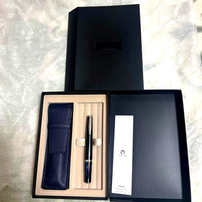 PILOT TIMELINE ballpoint pen with matte black body and blue marble grip alongside dedicated and pen cases