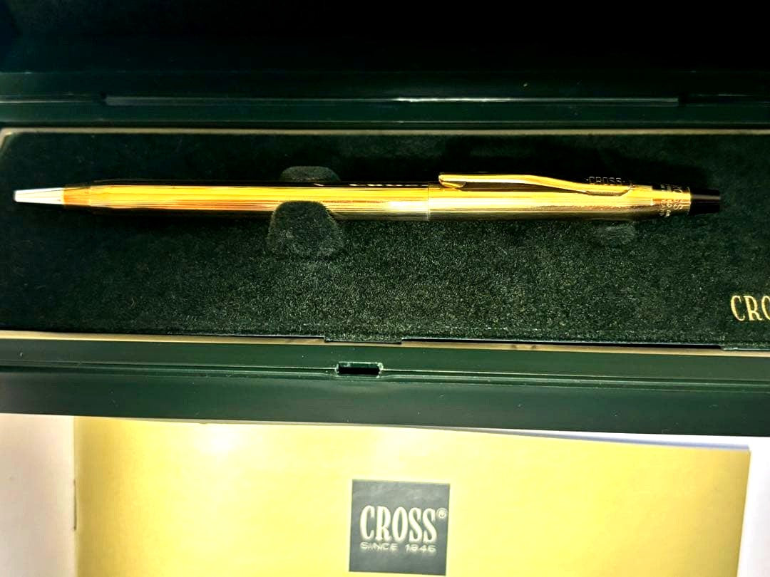 Gold CROSS ballpoint pen model クロ with sleek design and smooth finish