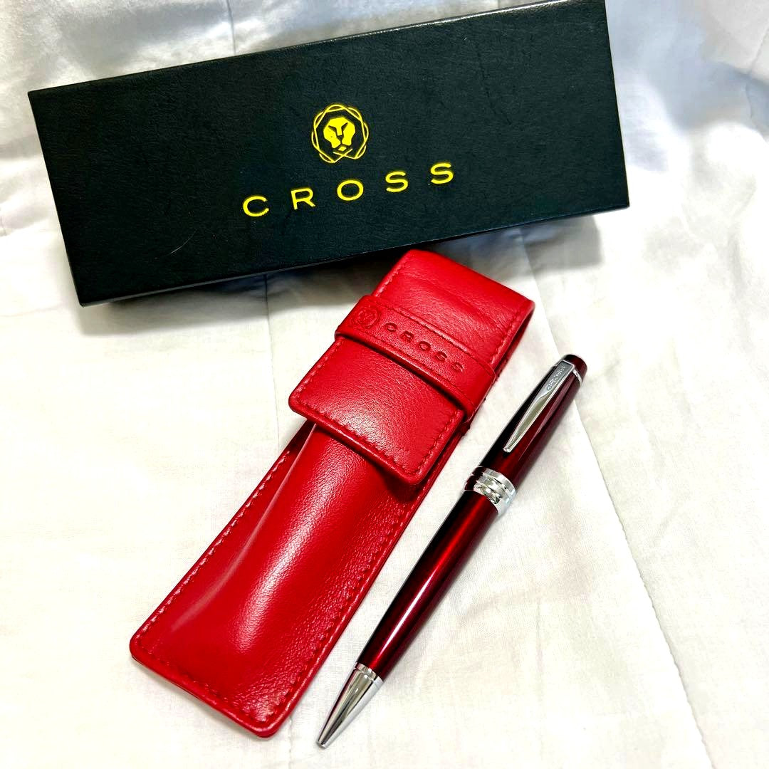 Two new CROSS ballpoint pens with black leather case on white background