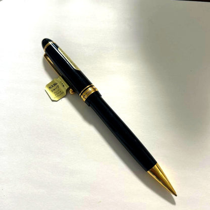 PILOT black ballpoint pen with gold accents and plastic body shown on white background