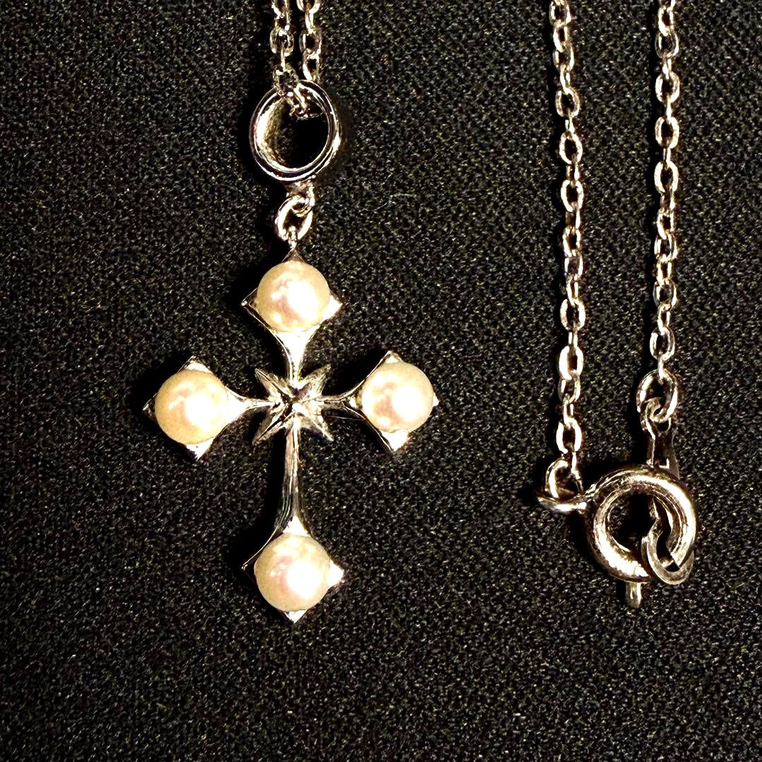 Mikimoto Akoya pearl cross necklace in silver with 19mm pearl and 42cm chain displayed on white background