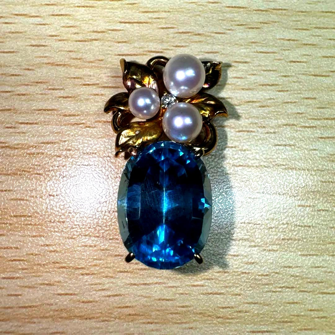 Tasaki necklace with 15.68ct blue topaz, pearl top, and small diamonds set in K18 gold