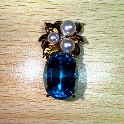 Tasaki necklace with 15.68ct blue topaz, pearl top, and small diamonds set in K18 gold