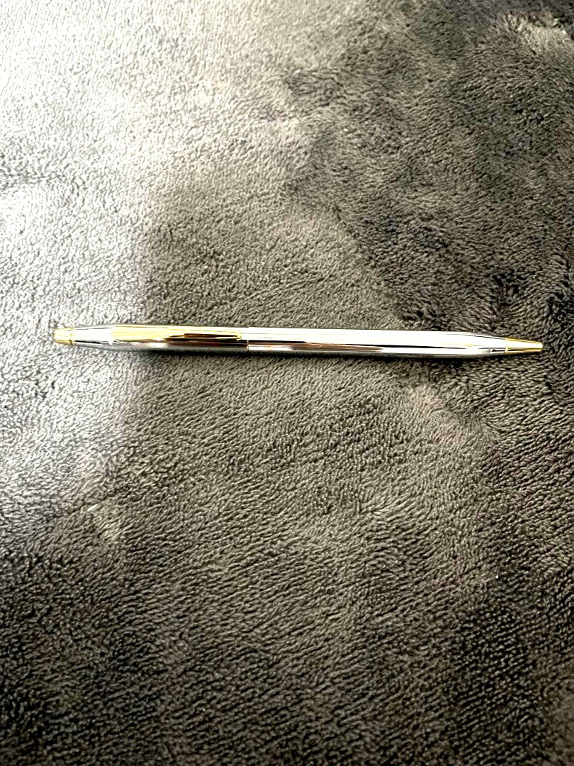 Silver CROSS metal ballpoint pen with clear body and sleek design