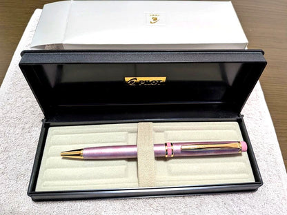 Pilot Grand Se Marble Pink ballpoint pen with gold accents and dedicated case on white background