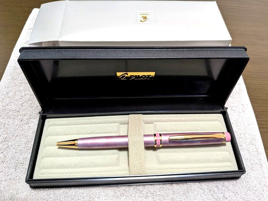 Pilot Grand Se Marble Pink ballpoint pen with gold accents and dedicated case on white background