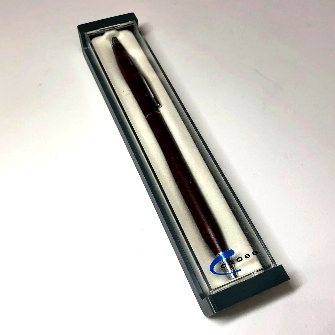 Cross Vintage dark red metal ballpoint pen with its dedicated case on a white background