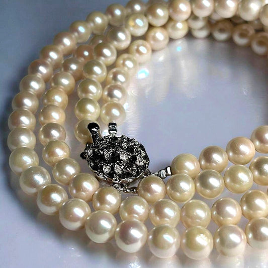 Two-strand Akoya pearl necklace with 6.5-7.0 mm pearls and silver marking, 41-44 cm length