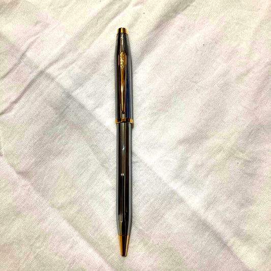 Used Cross brand ballpoint pen with tested writing sample, showing signs of use