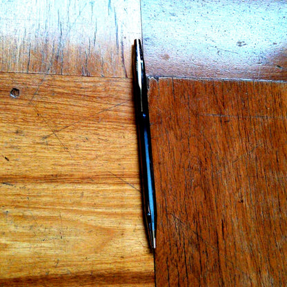 Cross Century silver and gold ballpoint pen made in the United States with metal body and oil-based ink