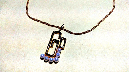Mikimoto pearl necklace with gold and silver chain and 25mm by 15mm pearl pendant