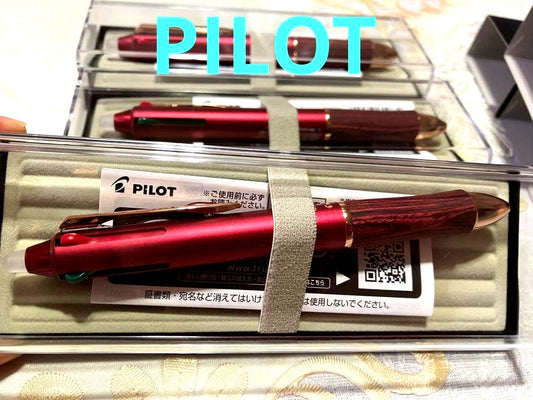 Set of three Pilot ballpoint pens in black, red, and blue with a black carrying case