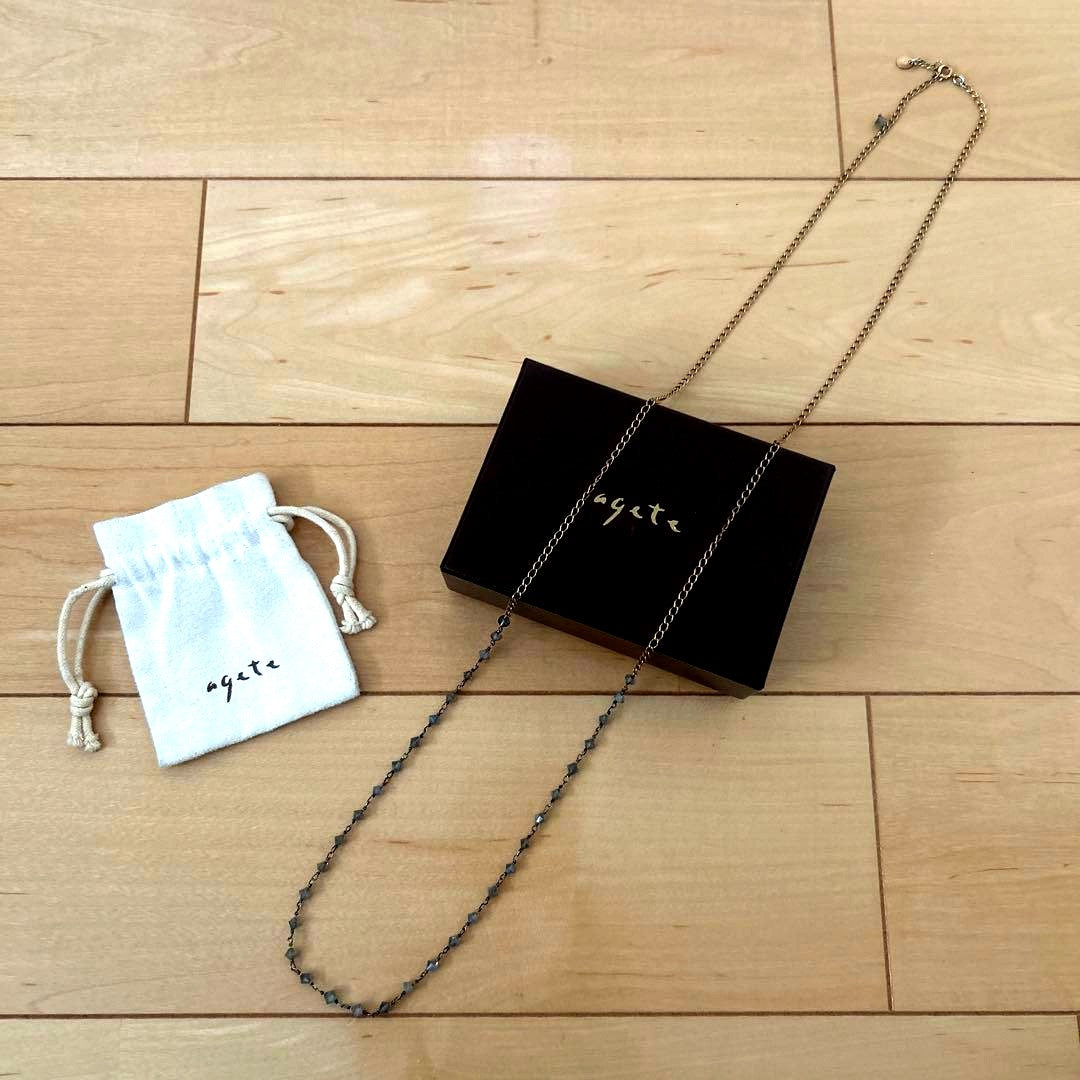 agete long necklace measuring 99 cm in length displayed on a white background