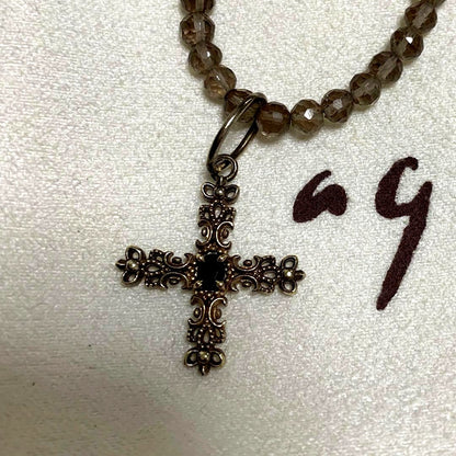 Light brown transparent smoky quartz necklace with gold cross pendant and silver top set