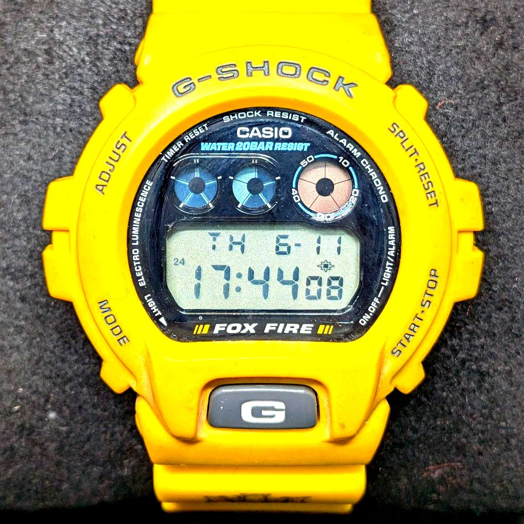 Casio G-Shock DW-6900H-9 Fox Fire collaboration watch with red and black design showing minor crack