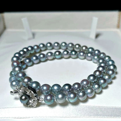 Akoya pearl necklace with 6.5-7.0mm round silver green pearls on a 41 cm silver chain marked SILVER