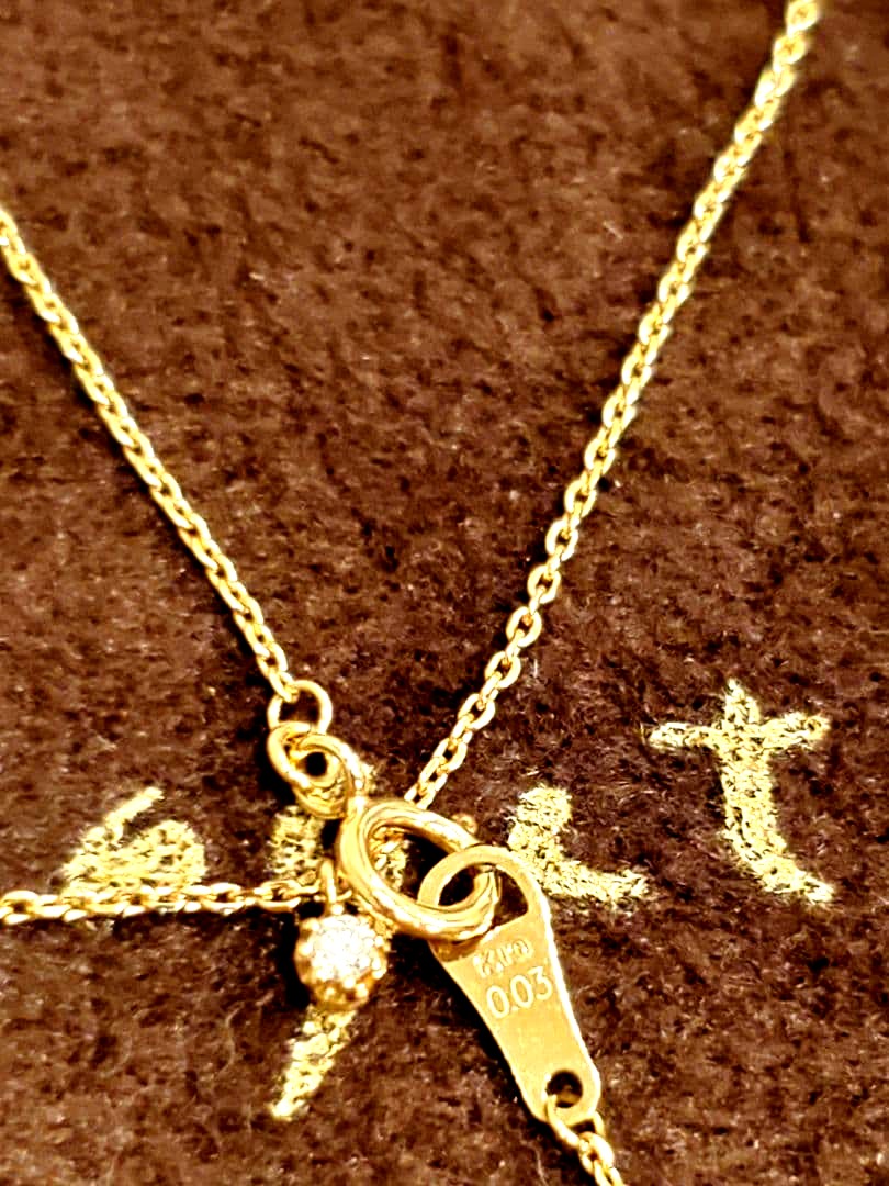 agete gold necklace featuring a 0.03 carat diamond pendant on a delicate chain