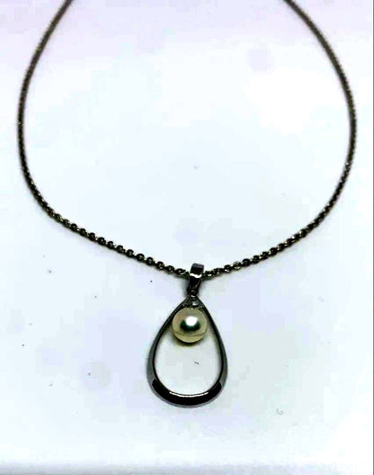 MIKIMOTO Akoya pearl necklace with silver chain, 45 cm long, displayed on white background