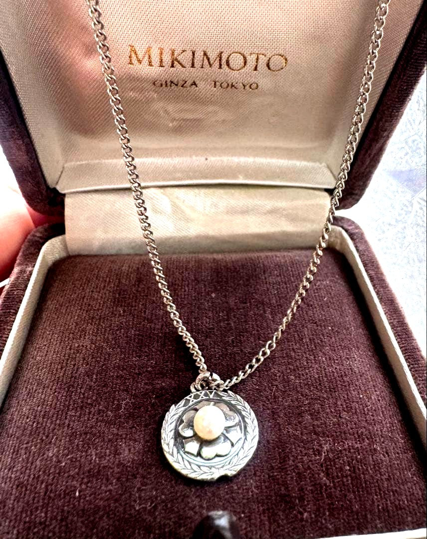 Mikimoto XXV silver wedding anniversary pendant with oxalis motif and pearl on a 46cm German silver chain