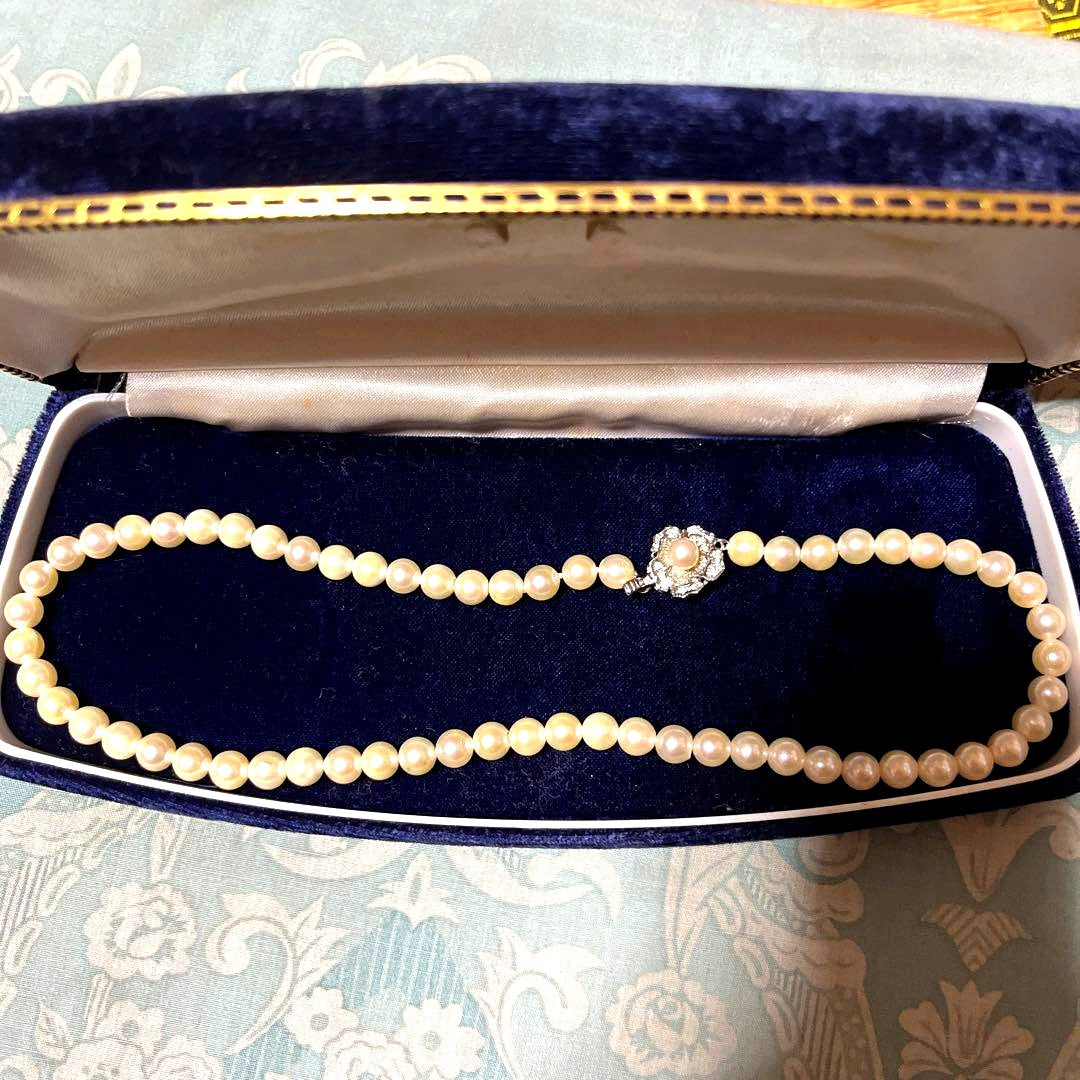Honest Tsubamaki Akoya pearl necklace with 6.5mm pearls and strong shine on a white background