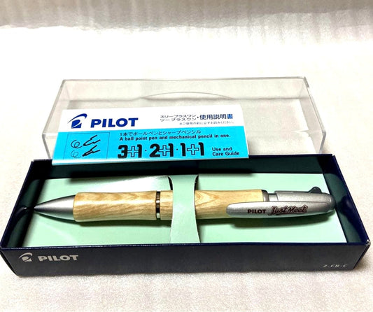 PILOT JustMeet wooden multi-function pen with three colors and mechanical pencil on a white background