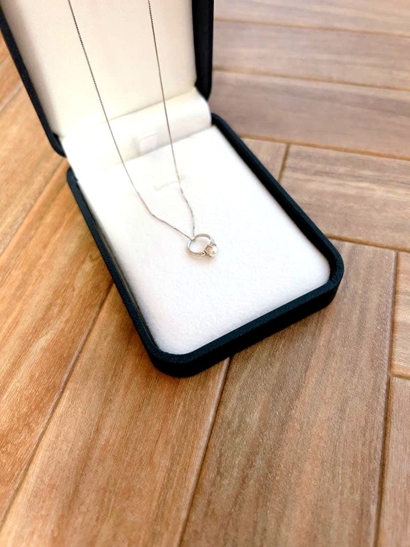 Baby Ring with Akoya Pearl on a 40cm platinum necklace chain
