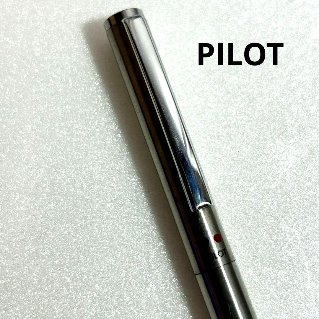 Discontinued Pilot Twist ballpoint pen in silver with two color ink mechanism, used condition