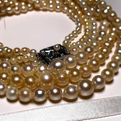 Akoya pearl triple gradient necklace with 3.4-7.3mm white semi-round pearls, 42.7cm length, silver imprint