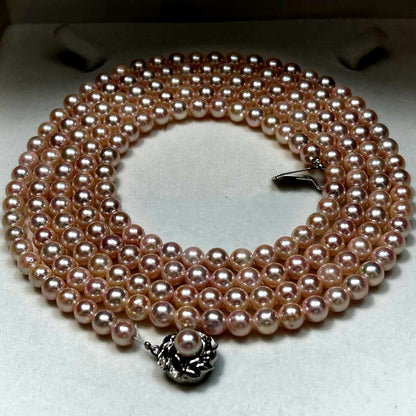 Long Akoya pearl necklace with 6.5mm pink pearls measuring 124cm with sterling silver details
