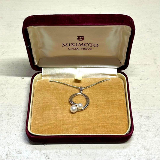 MIKIMOTO pearl necklace in silver color with 24 cm length displayed on a white background