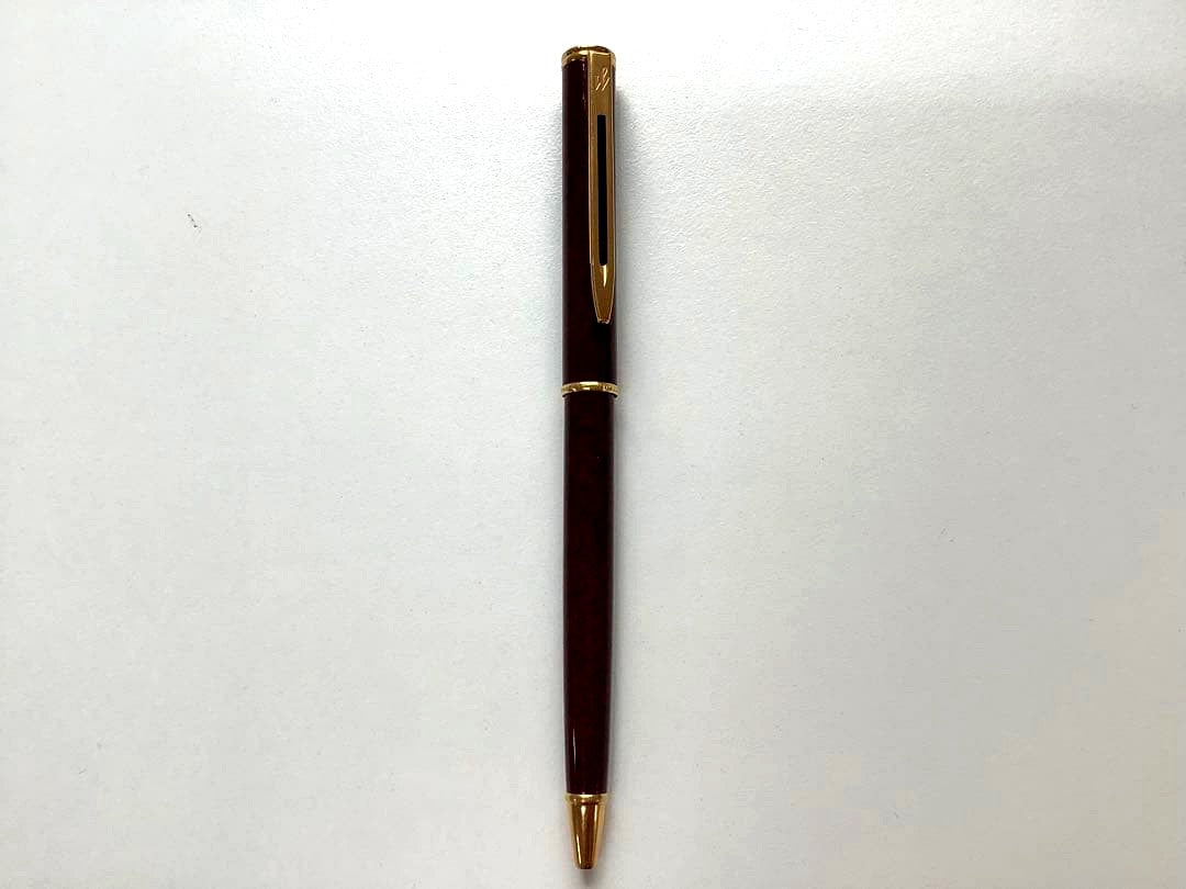 Used Waterman ballpoint pen without ink cartridge displayed on white background