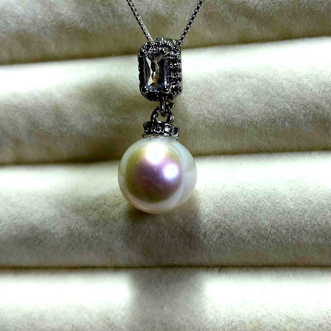 Akoya pearl necklace with 10mm large white pearls and silver pendant featuring baguette and melee stones