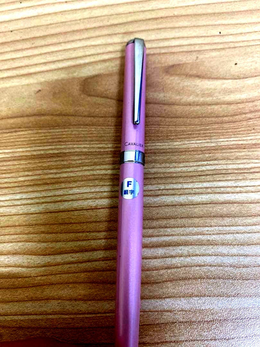 Pilot Cavalier Fountain Pen in pink with fine (F) tip shown uncapped on white background