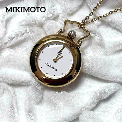 Mikimoto pendant watch with 4mm pearl and 2.5cm clock on a 70cm chain with clock stand