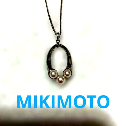 Mikimoto baby pearl necklace with 5mm white pearl on silver chain featuring brand logo and silver engraving
