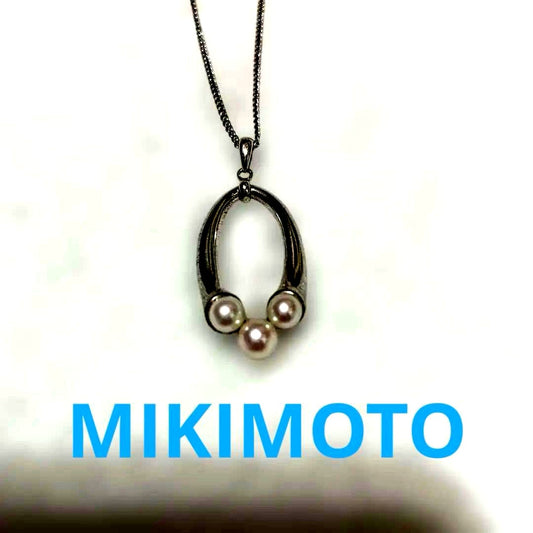 Mikimoto baby pearl necklace with 5mm white pearl on silver chain featuring brand logo and silver engraving