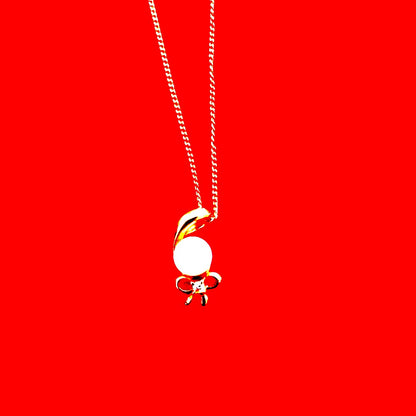 K18 yellow gold necklace with pearl and diamond decorations in a ribbon motif weighing 4 grams