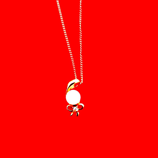 K18 yellow gold necklace with pearl and diamond decorations in a ribbon motif weighing 4 grams