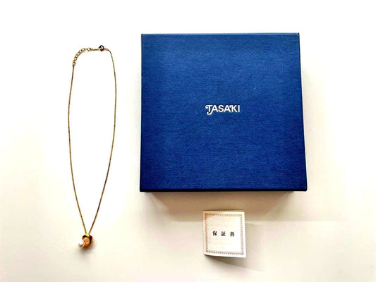 TASAKI pearl necklace in gold color with mother of pearl, displayed with box and guarantee