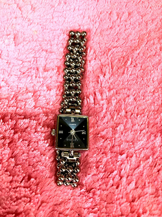 Casio ladies square watch with black face and stainless steel metal band