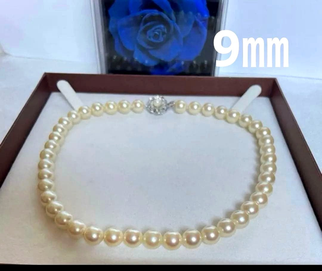 Pink pearl necklace with 9mm cowrie pearls in champagne gold color and silver clasp, 39cm length