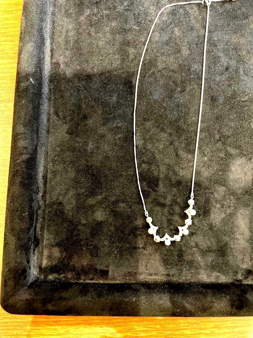 Silver pearl necklace with 200 mm length and delicate design displayed on white background