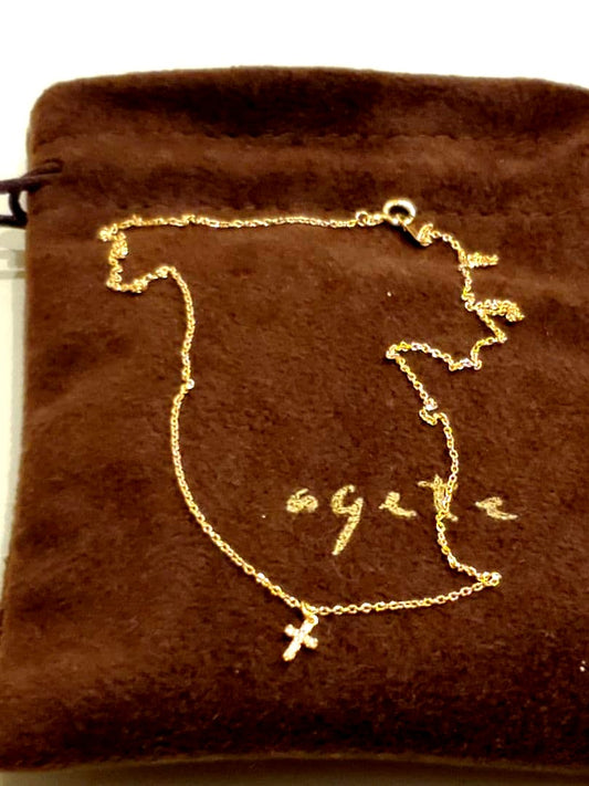 Agete gold necklace with a detailed cross motif pendant on a fine gold chain