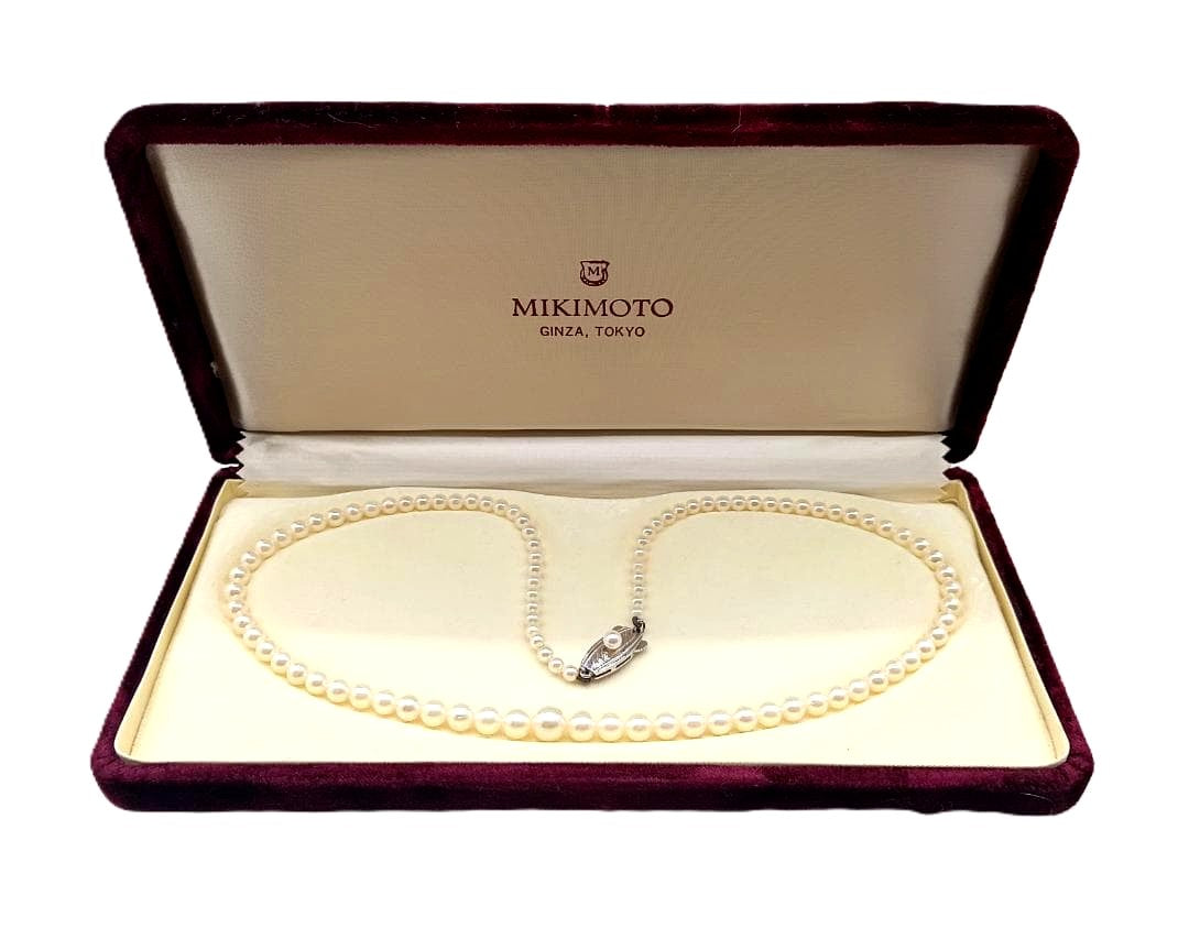 Mikimoto Akoya pearl gradient necklace with pearls ranging 3 to 7 mm displayed with velour case